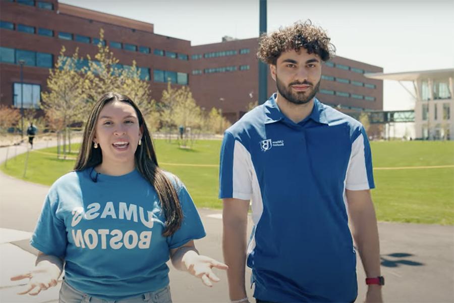 UMass Boston Students Abdul and Isabella stand on the Quad introducing the video tour